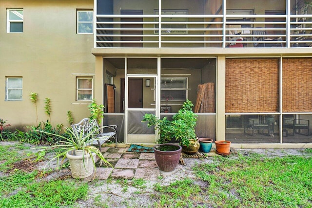 entrance to property with a balcony