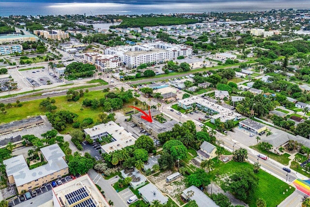 birds eye view of property featuring a water view