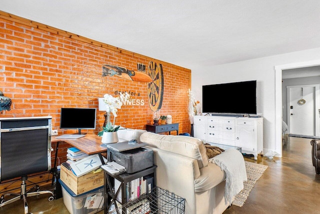 living room featuring a textured ceiling, brick wall, and concrete flooring