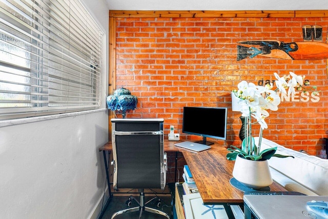 home office featuring brick wall