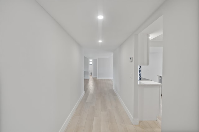 hallway featuring light hardwood / wood-style flooring