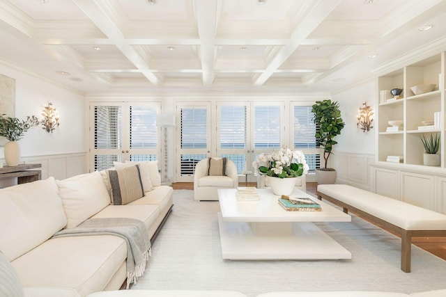 living room featuring ornamental molding, coffered ceiling, beam ceiling, and french doors