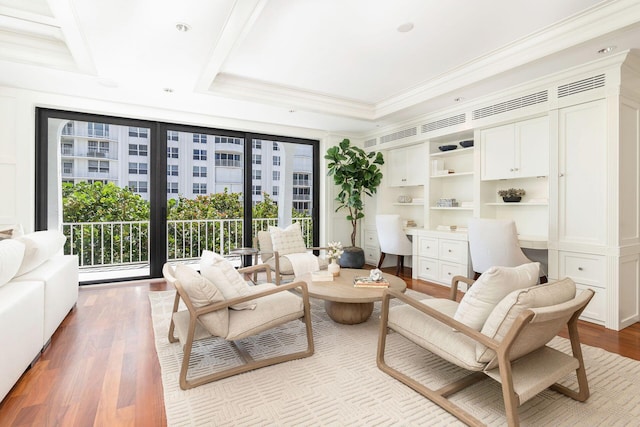 2275 S Ocean Boulevard 307 & 308, Palm Beach, FL 33480 - sitting room with ornamental molding, a raised ceiling, built in desk, and wood finished floors