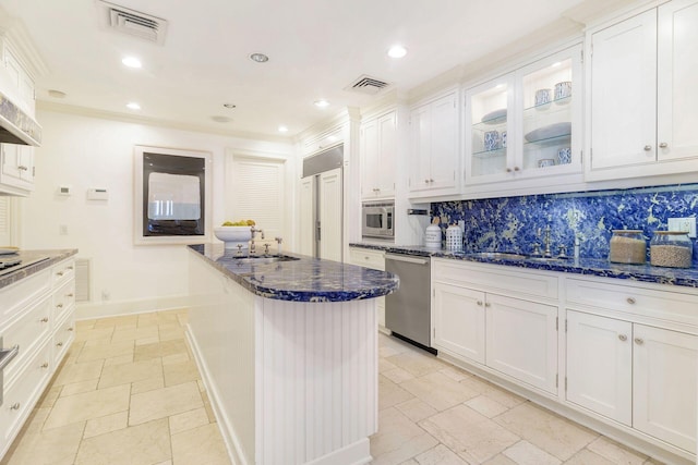 kitchen with paneled built in refrigerator, dark stone countertops, white cabinets, and dishwasher