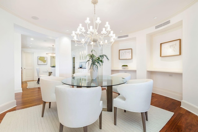 2275 S Ocean Boulevard 307 & 308, Palm Beach, FL 33480 - dining space featuring crown molding, visible vents, and wood finished floors