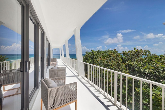 balcony featuring a water view