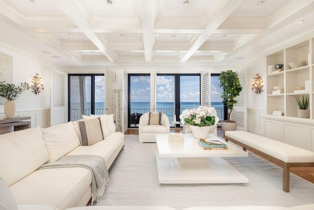 2275 S Ocean Boulevard 307 & 308, Palm Beach, FL 33480 - living area featuring ornamental molding, coffered ceiling, a decorative wall, and beamed ceiling