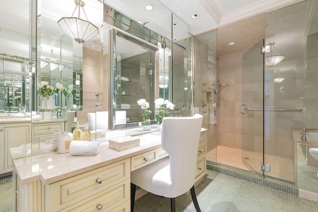 bathroom featuring ornamental molding, vanity, tile patterned floors, and a shower with shower door