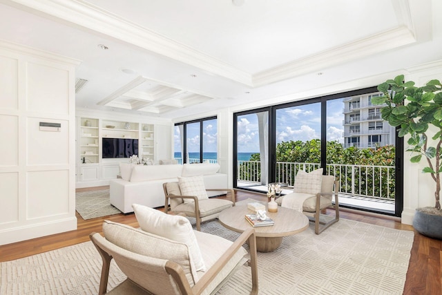 2275 S Ocean Boulevard 307 & 308, Palm Beach, FL 33480 - living area with built in shelves, wood finished floors, beamed ceiling, ornamental molding, and coffered ceiling
