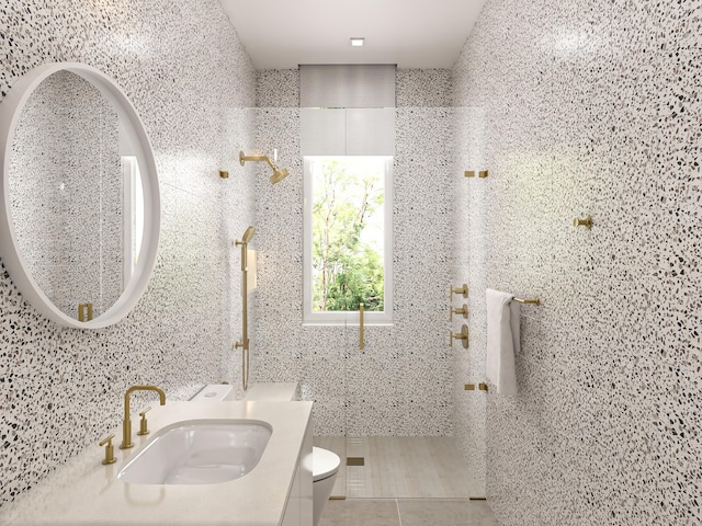 bathroom with toilet, walk in shower, vanity, and tile patterned flooring