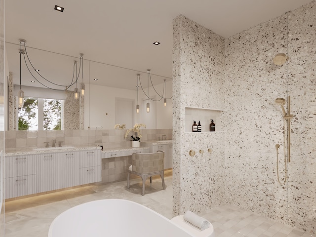 bathroom featuring a soaking tub, tile walls, vanity, and a walk in shower