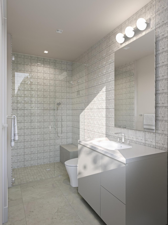 full bathroom with visible vents, toilet, vanity, a stall shower, and tile walls