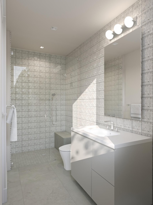 full bath featuring vanity, visible vents, a shower stall, tile walls, and toilet