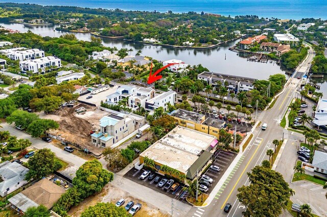 birds eye view of property with a water view