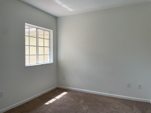 5071 SE Mariner Garden Cir, Stuart, FL 34997 - carpeted spare room featuring baseboards