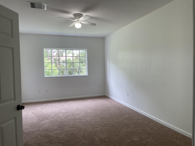 5071 SE Mariner Garden Cir, Stuart, FL 34997 - unfurnished room featuring baseboards, ceiling fan, visible vents, and carpet