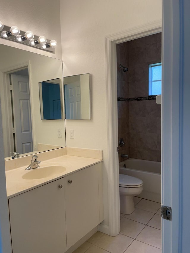 5071 SE Mariner Garden Cir, Stuart, FL 34997 - bathroom with toilet, tile patterned flooring, vanity, and shower / tub combination