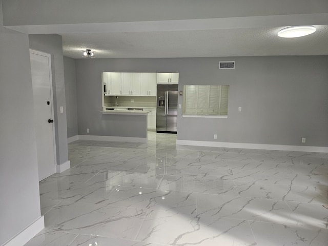 empty room with a textured ceiling