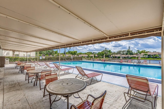 view of pool featuring a patio