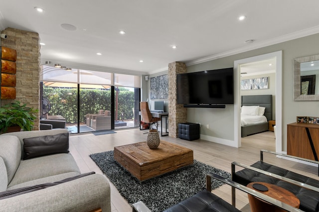 living room with crown molding and light wood-type flooring