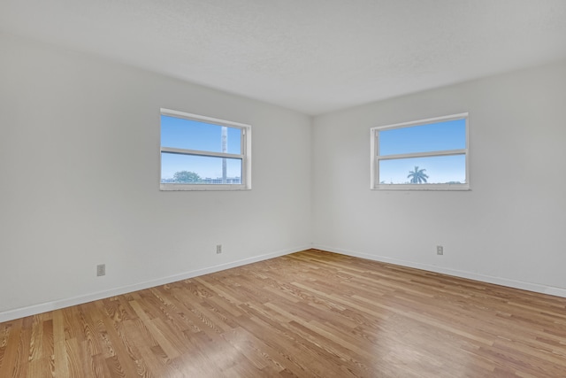 unfurnished room featuring light hardwood / wood-style floors