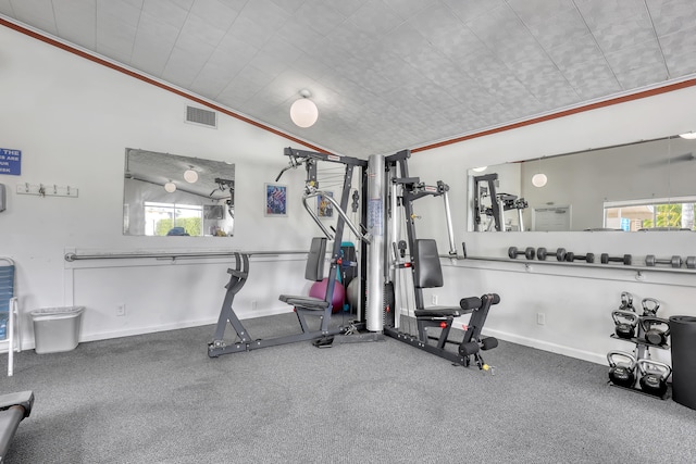 gym with a wealth of natural light and vaulted ceiling