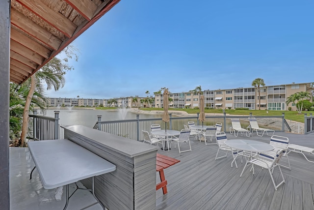 wooden deck with a water view