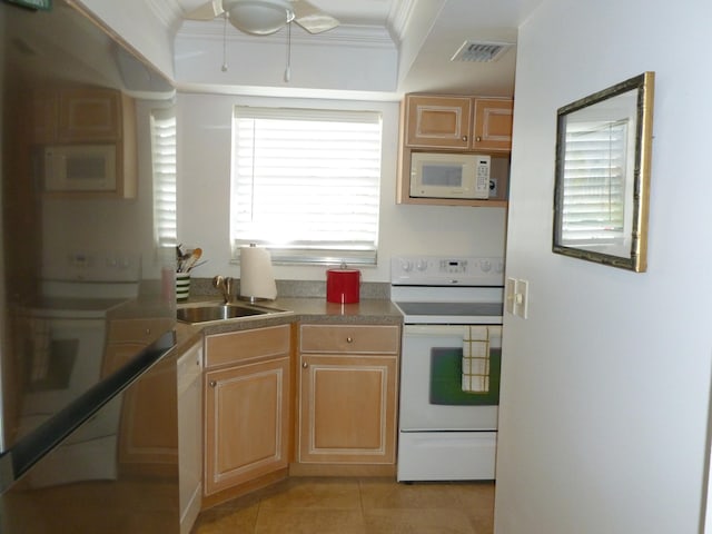 kitchen featuring light brown cabinetry, white appliances, crown molding, sink, and light tile patterned floors