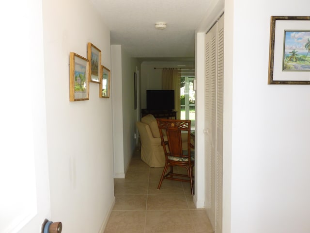 hallway with light tile patterned floors