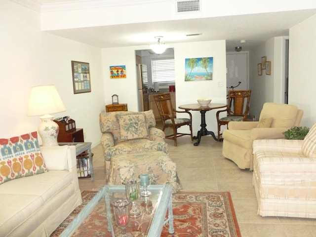 tiled living room with ornamental molding