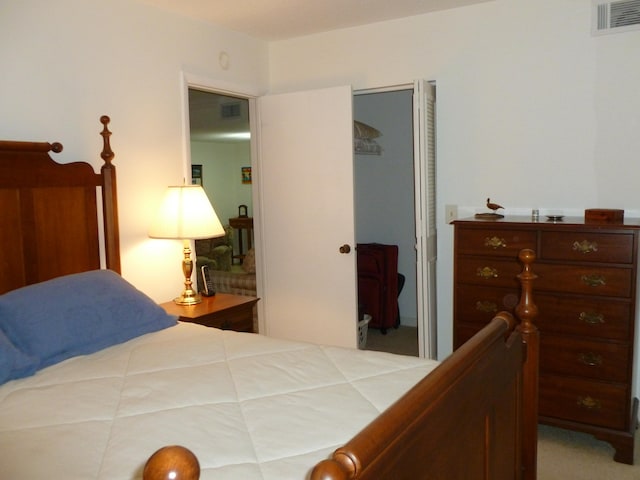 bedroom featuring carpet flooring and a closet