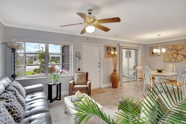 living room featuring ceiling fan with notable chandelier, crown molding, and a textured ceiling