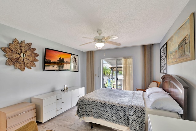 bedroom featuring light wood-type flooring, a textured ceiling, access to outside, and ceiling fan