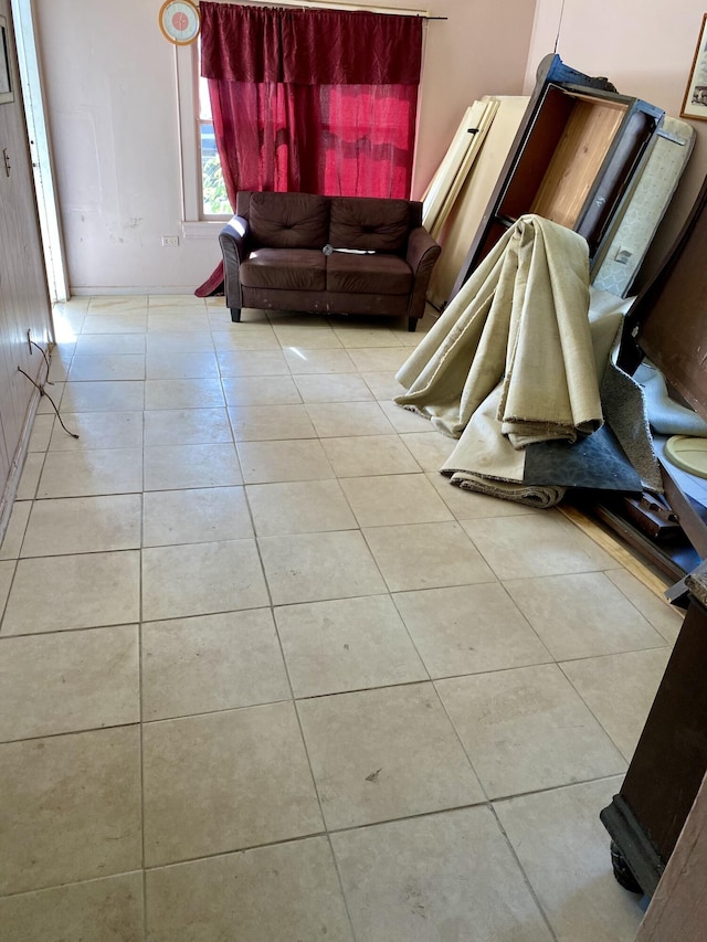 unfurnished living room featuring light tile patterned floors