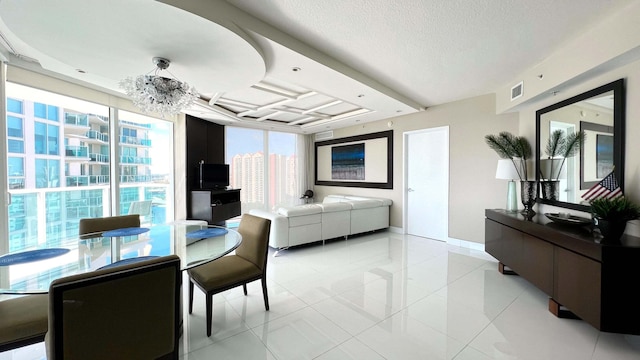 interior space with light tile patterned floors, a textured ceiling, and an inviting chandelier