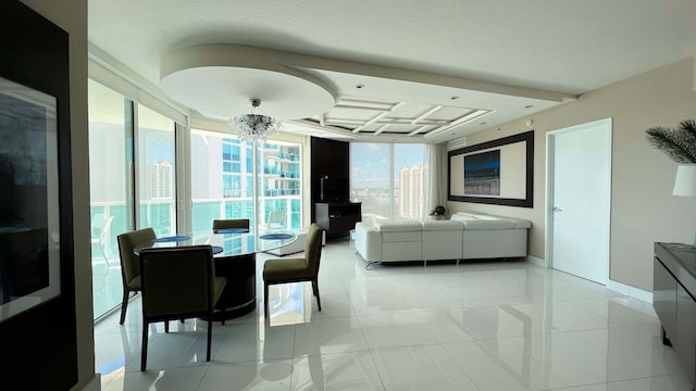 dining room with a textured ceiling, a notable chandelier, and light tile patterned flooring