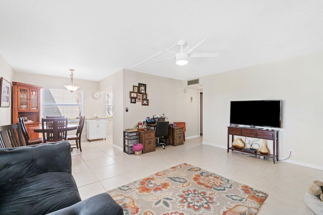 living room with light tile patterned floors and ceiling fan