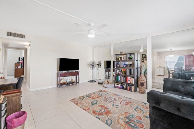 tiled living room with ceiling fan