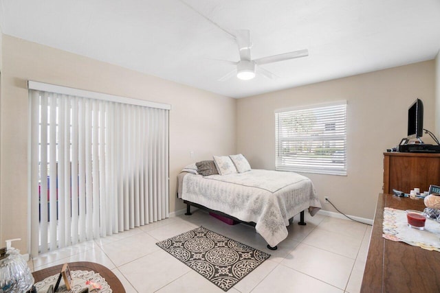 tiled bedroom with ceiling fan