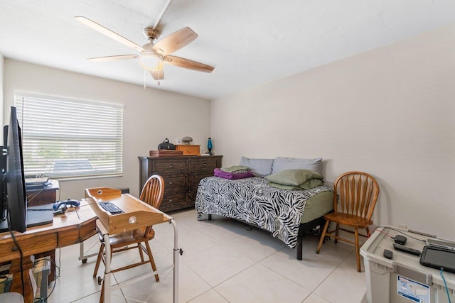 tiled bedroom featuring ceiling fan