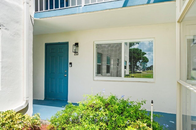 doorway to property featuring a balcony