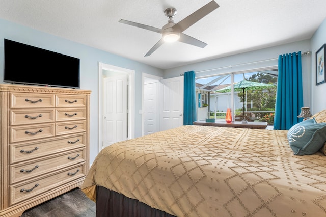 bedroom featuring a textured ceiling, ceiling fan, and hardwood / wood-style floors