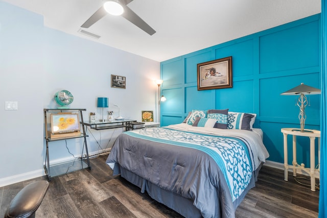 bedroom with ceiling fan and dark hardwood / wood-style flooring