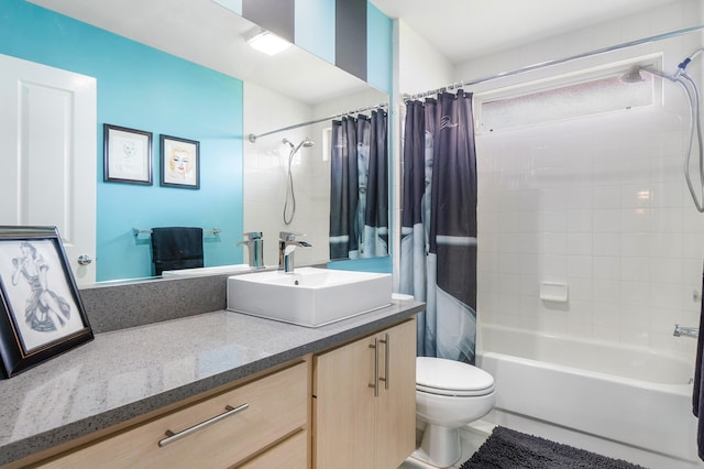 full bathroom featuring vanity, toilet, and shower / bathtub combination with curtain