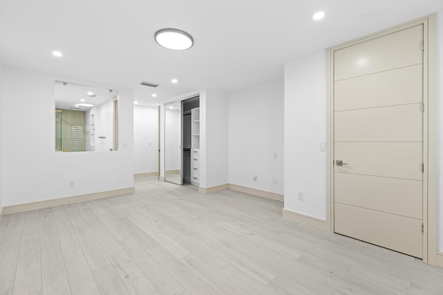 basement featuring light wood-type flooring