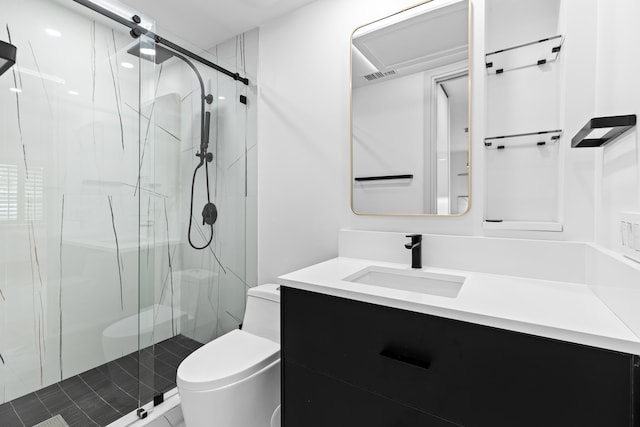 bathroom with vanity, toilet, and a shower with door