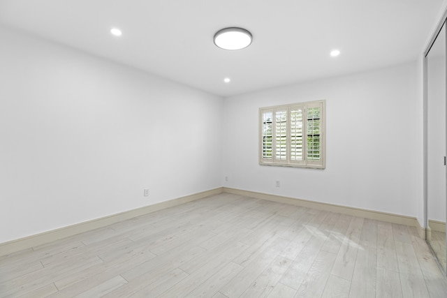 unfurnished room featuring light wood-type flooring