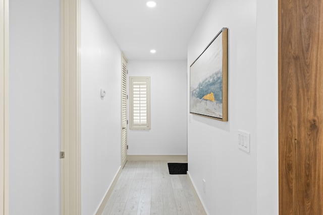 corridor with light wood-type flooring