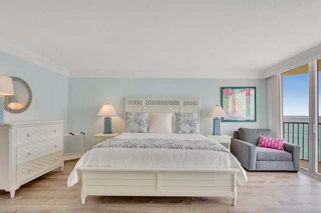 bedroom with access to outside, light wood-type flooring, and crown molding