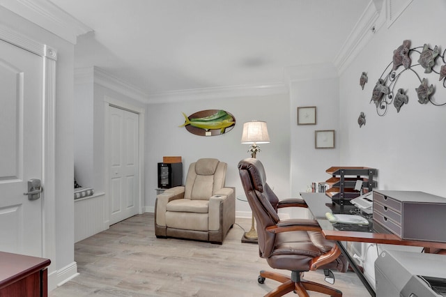 office space with light wood-type flooring and ornamental molding